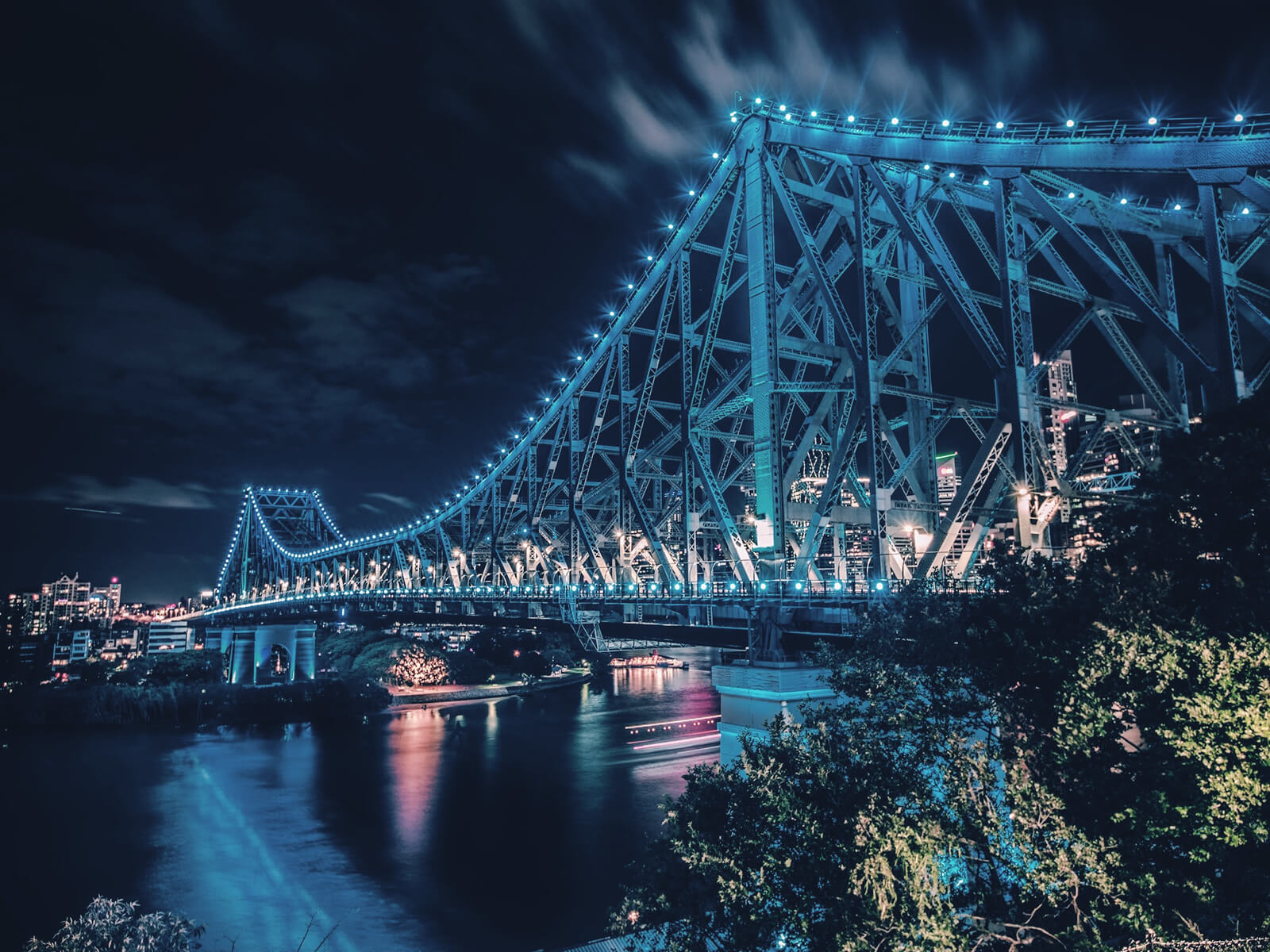 Story Bridge lit up at nightime