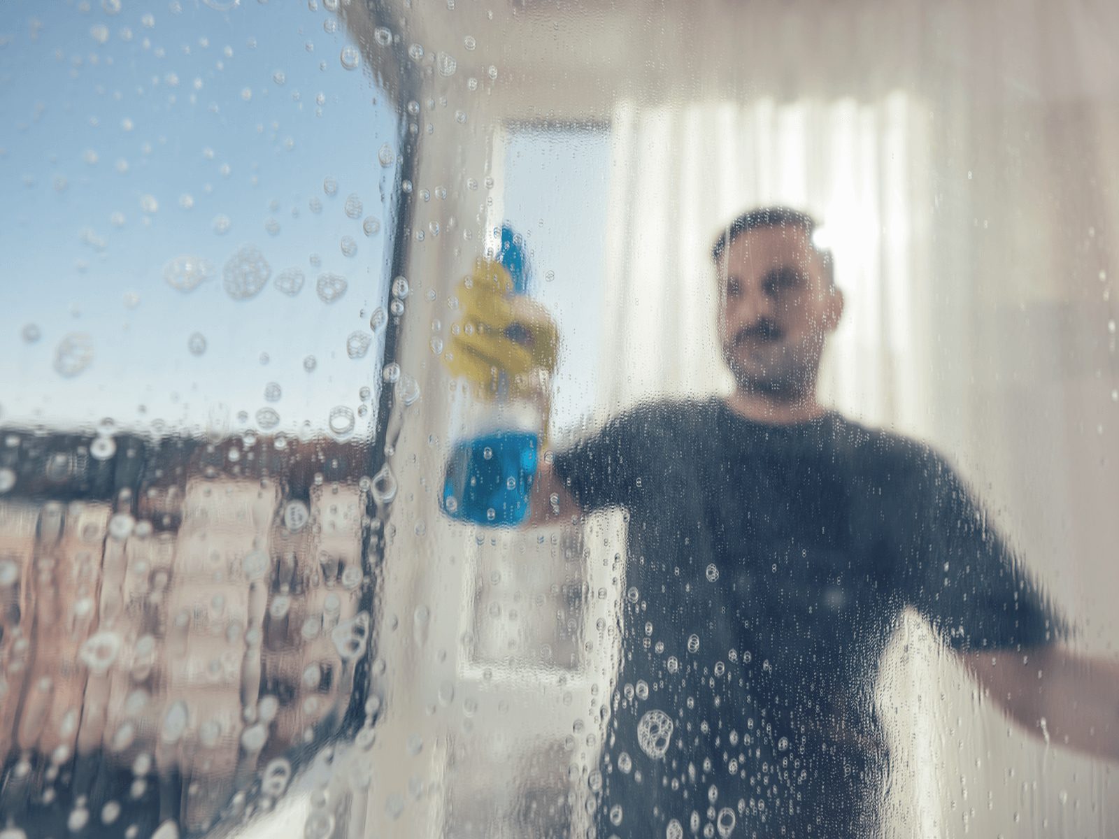 person cleaning windows