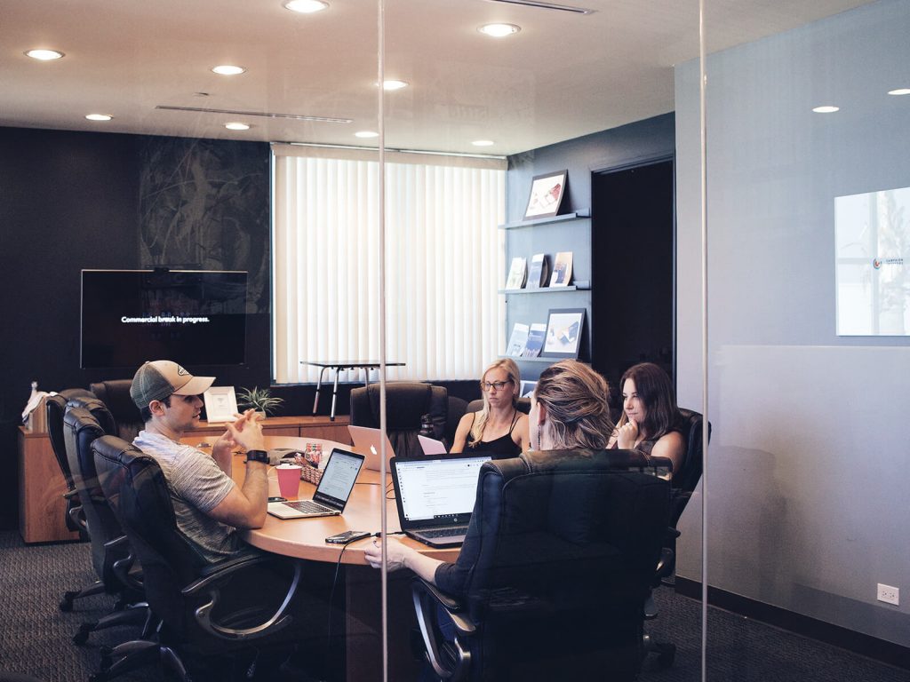 People sitting in a board room.