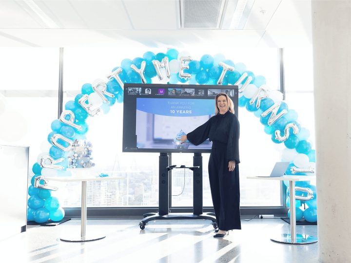 Sarah Dawson standing under a balloon arch