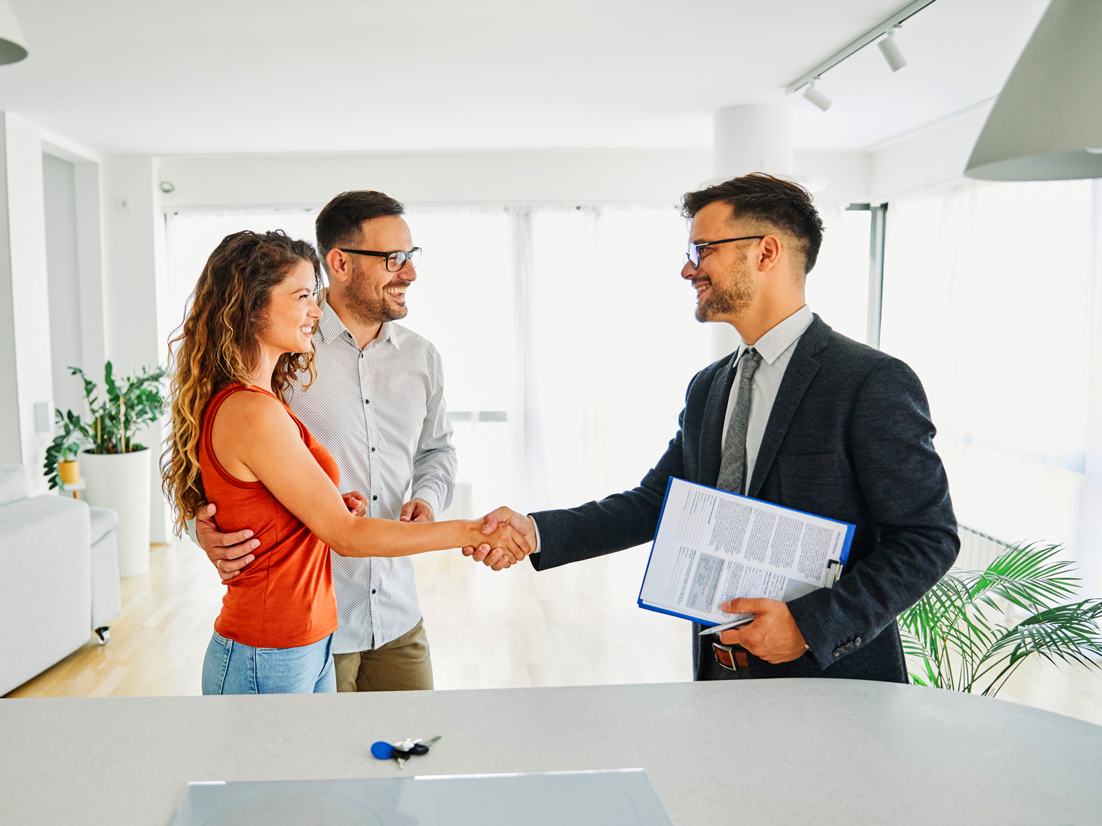 Property Manager and clients shaking hands