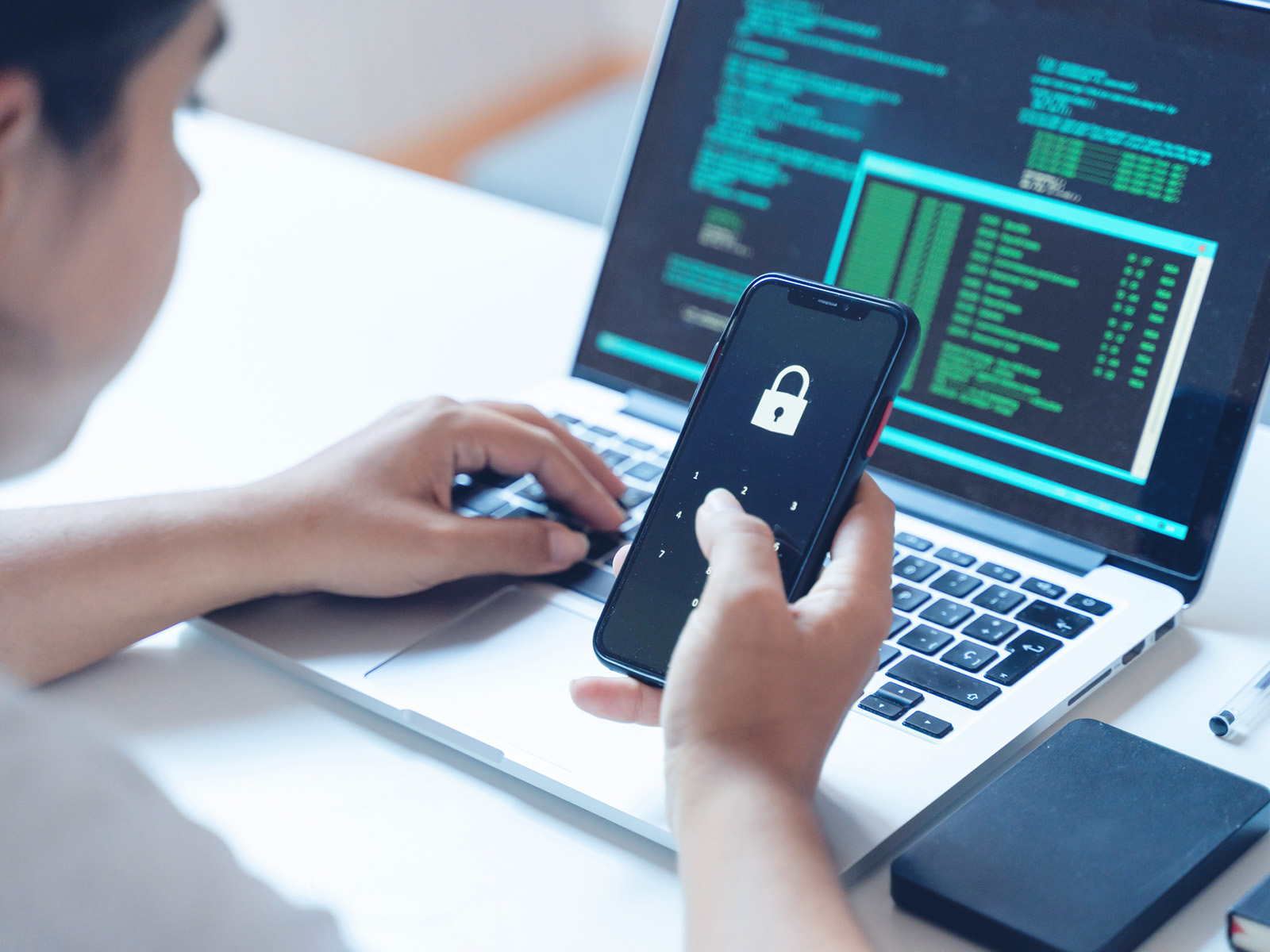 Property Manager checks cybersecurity on smart phone